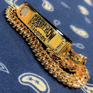 Snoop Dogg Wears Custom Gold Ledger Wallet Chain At WrestleMania 39