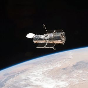 A Figure-Eight in Deep Space: Hubble Image Shows Gravity Warping Distant Galaxies