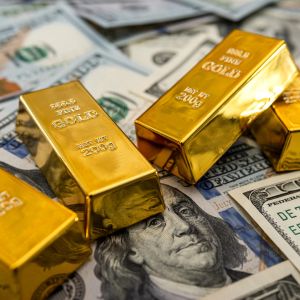 Gold slides as dollar gains on sentiment about pending US trade decisions