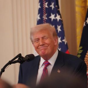 Photos: Trump Signs the GENIUS Act Into Law
