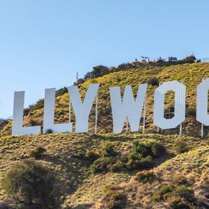 Man Scales Hollywood Sign to Hype Vigilante Token—Price Soars, Then Crashes